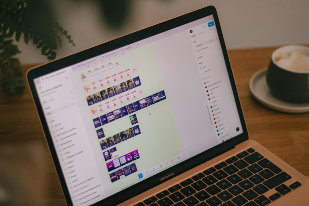 A laptop screen displays video editing software.