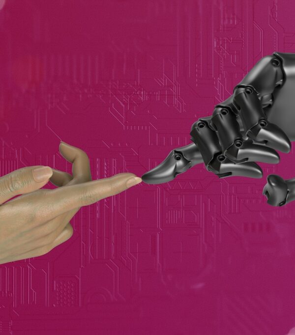 two hands touching each other in front of a pink background